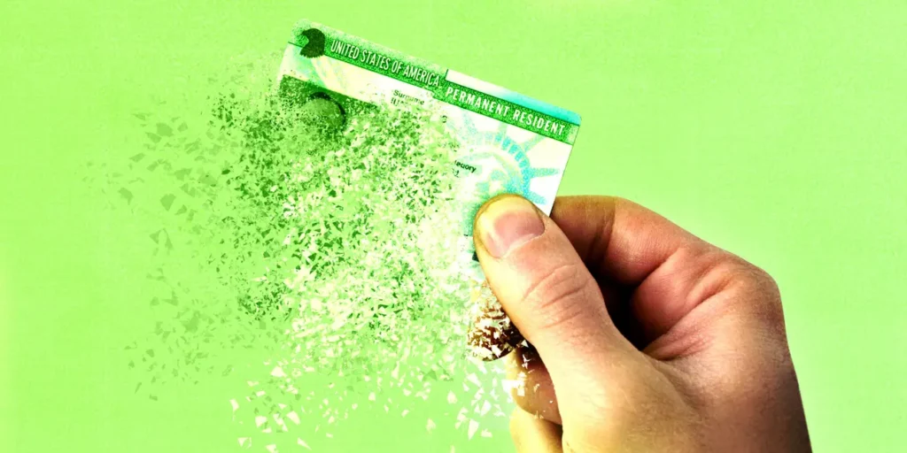 An illustration of a green card dissolving in front of a green background.