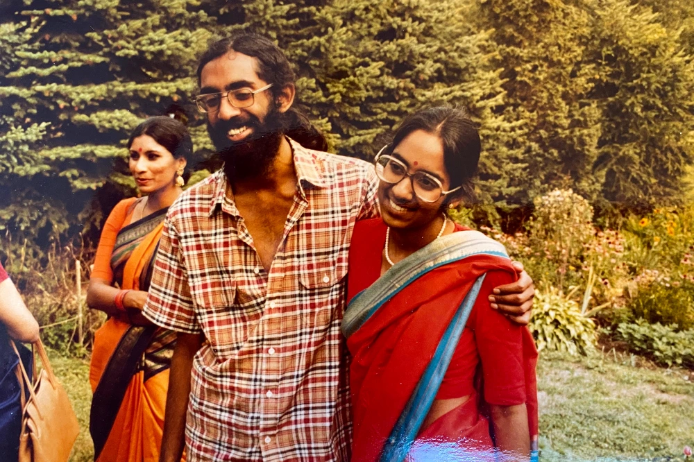 Tejaswini Rao chats with party guests while Subramanyam and Saraswathi Vedam embrace during a meet and greet
