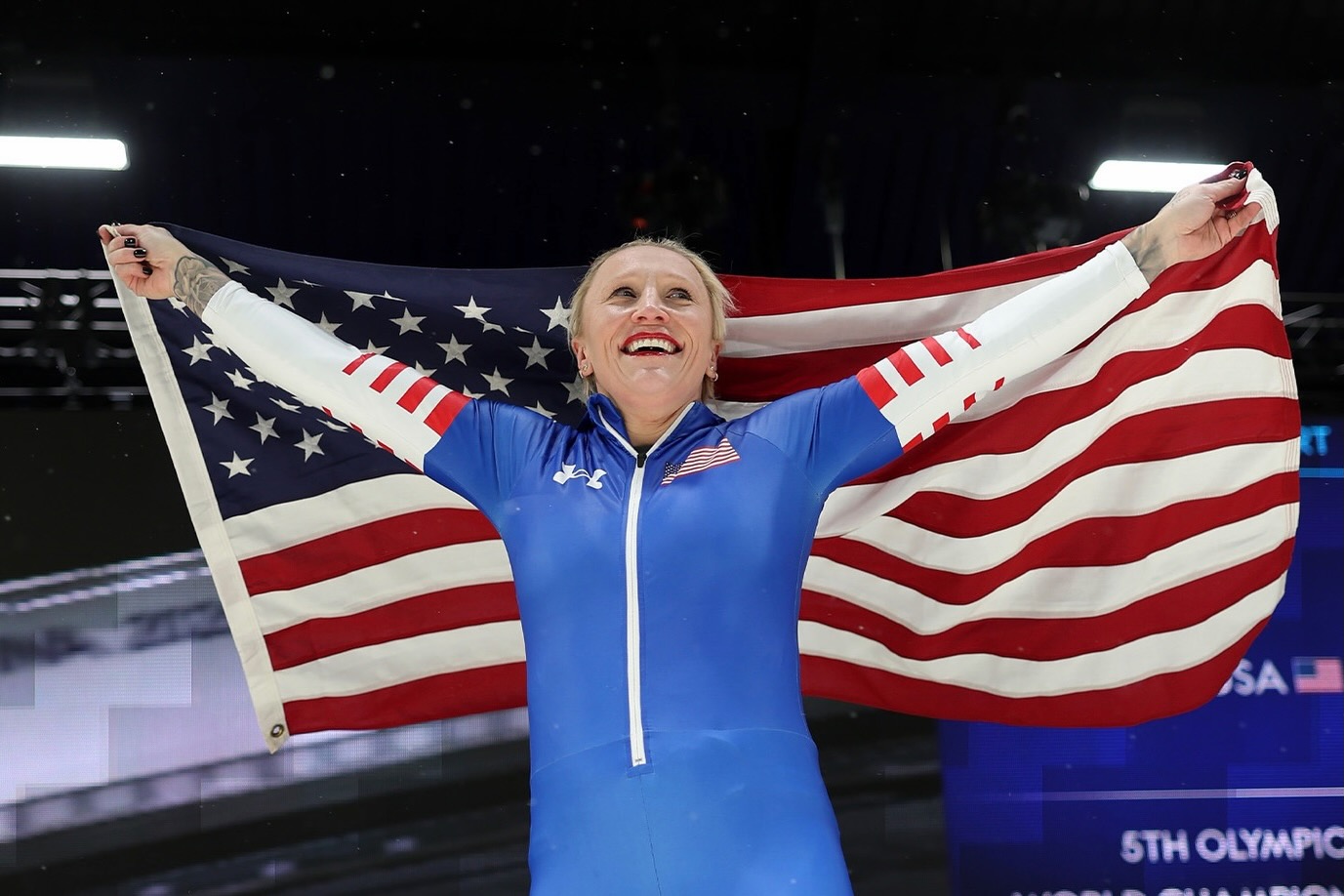 Olympic athlete Kaillie Humphries celebrating a historic achievement at the 2026 Winter Olympics in Milan-Cortina.
